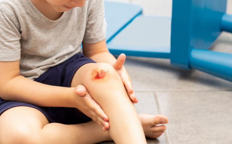 Child with injured knee