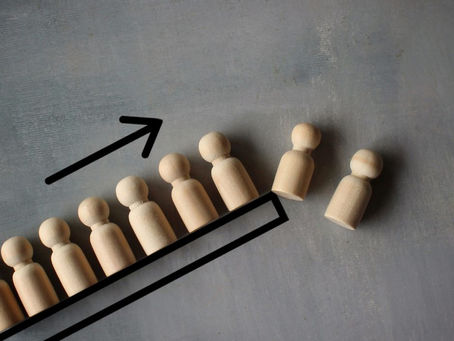 the future of volunteer management as depicted by pawns falling off an assembly line