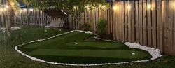 Immaculate synthetic turf putting green for golf enthusiasts