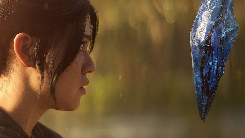 Close-up of a person's profile with dark hair and a serious expression, gazing intently at a large, blue, glowing crystal hovering in the air to their right.