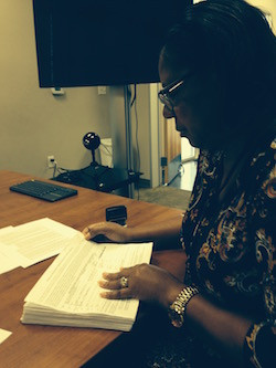 Bastrop City Secretary, Ann Franklin, looking over the petitions for "Reasonable Petition Requirements"