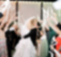 Bride and groom kiss inside wedding reception venue in West Virginia during wedding exit 