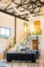 Photo by Melissa Kincaid Photography - White Reception with Curved Staircase