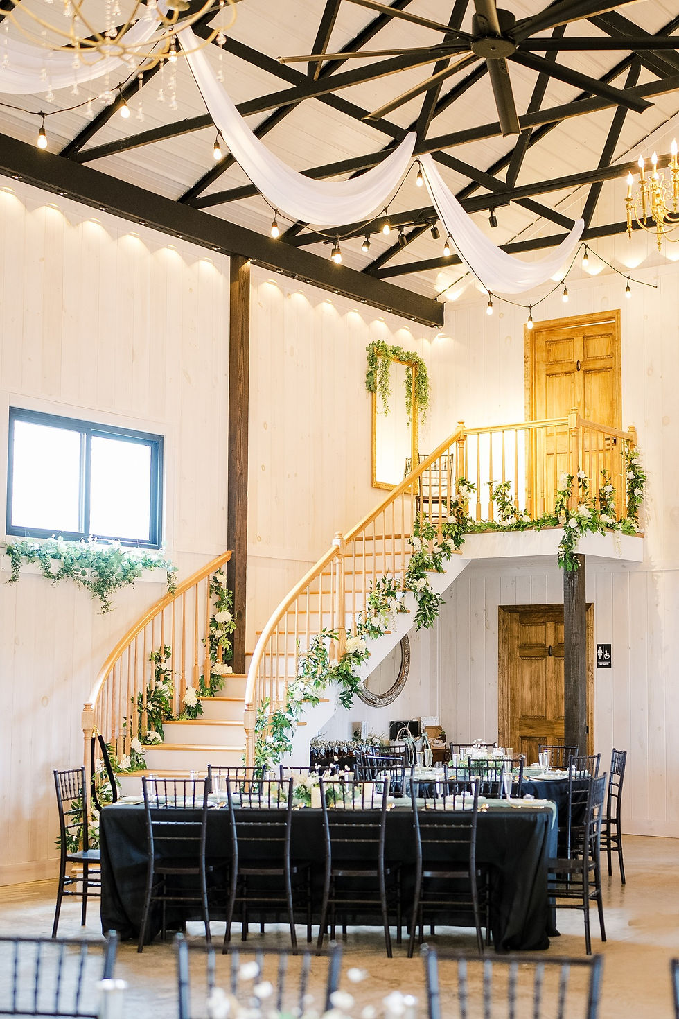 Photo by Melissa Kincaid Photography - White Reception with Curved Staircase