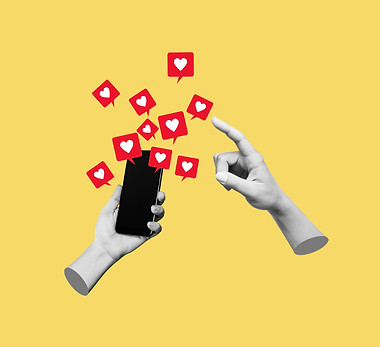 Female hand pointing to like symbols of social networks from mobile phone with black scree