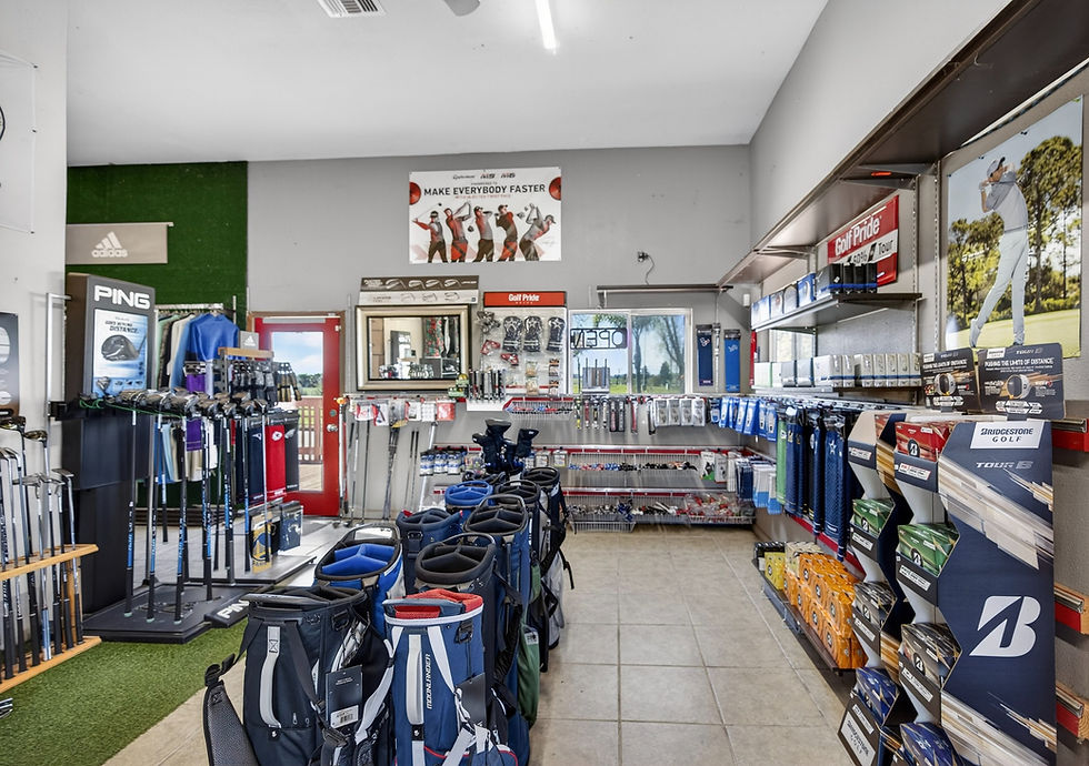 Interior of the Leader Golf pro shop with apparel, clubs, and accessories on display