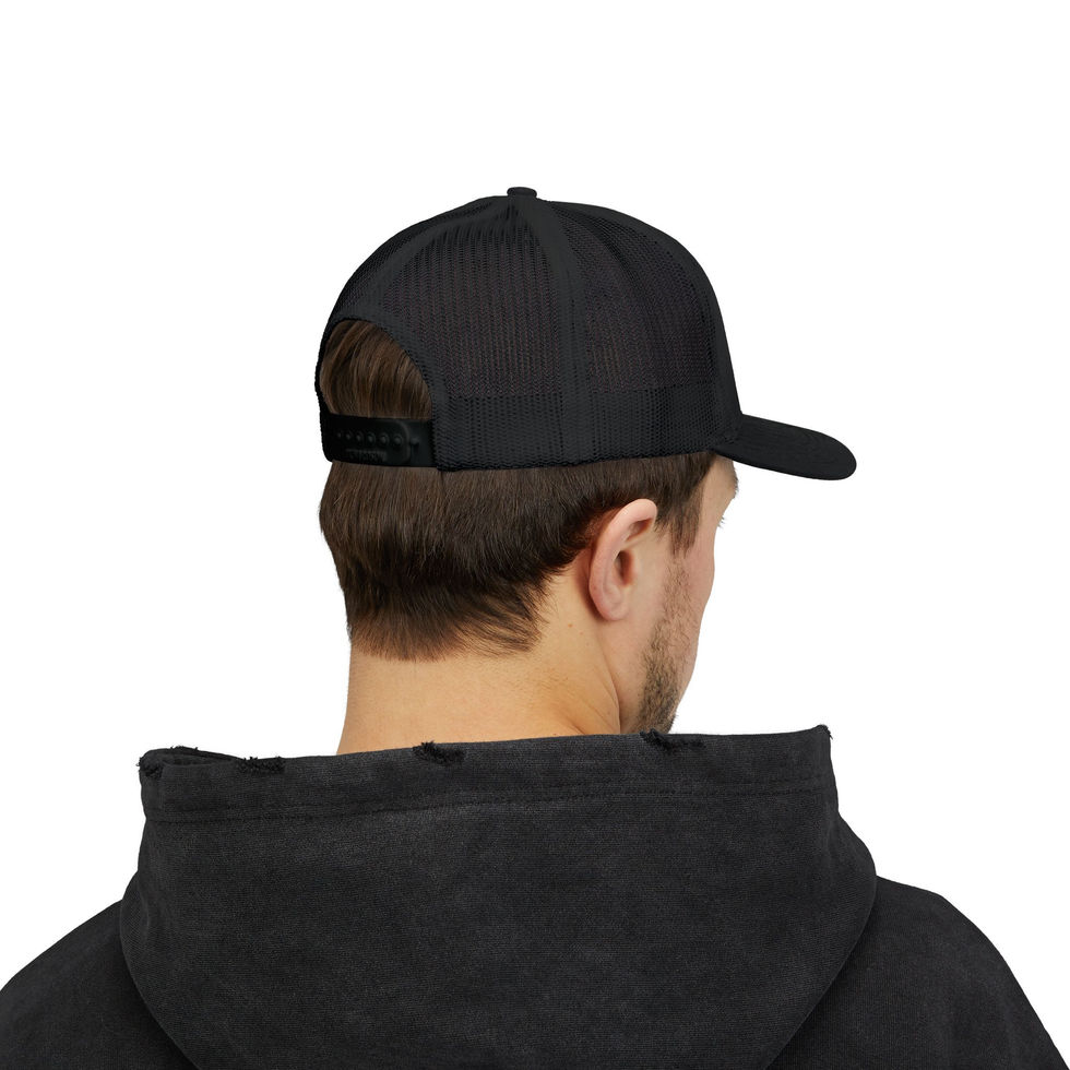 Man wearing black mesh back trucker cap