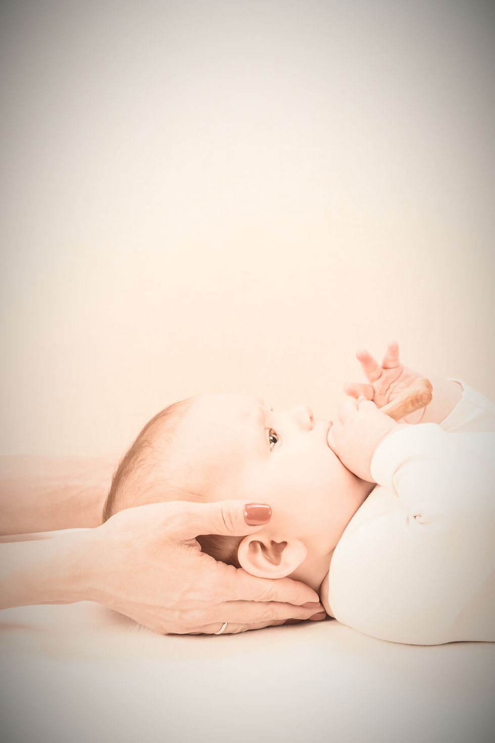 therapist examining an infant's head shape