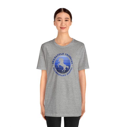 Gray t-shirt featuring a blue equestrian logo for Colts Spirit Wear, headed by Laura Butler, newly hired CCES principal after Dr C announced retirement.