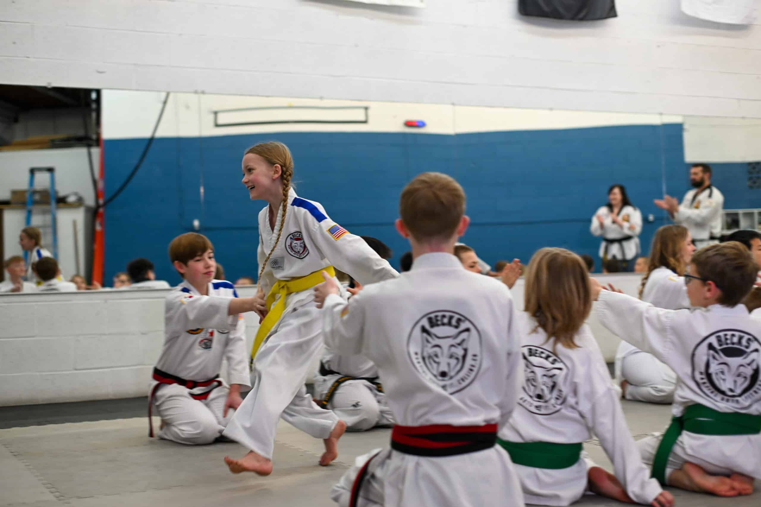 a student runs through class giving high fives