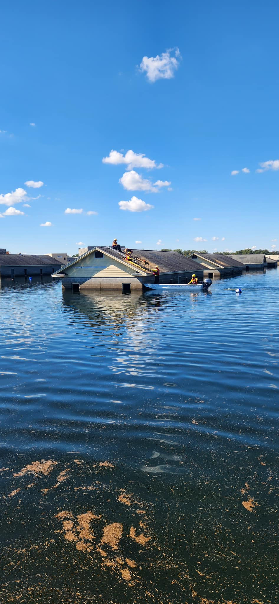 Submerged house rooftops after flooding for Task Force 1