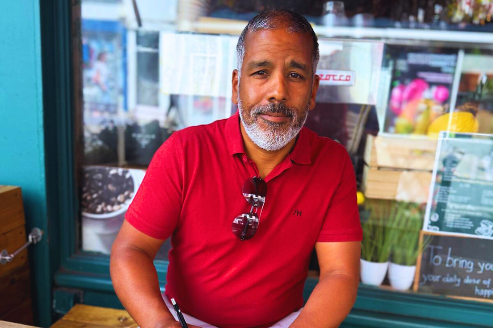 Photo of Kevin A Davidson working at a cafe on location in Brighton, UK