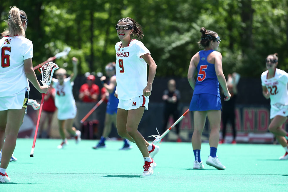 Libby May celebrates a goal scored in the game against Florida