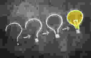 chalkboard illustration of a question mark turning into an idea lightbulb