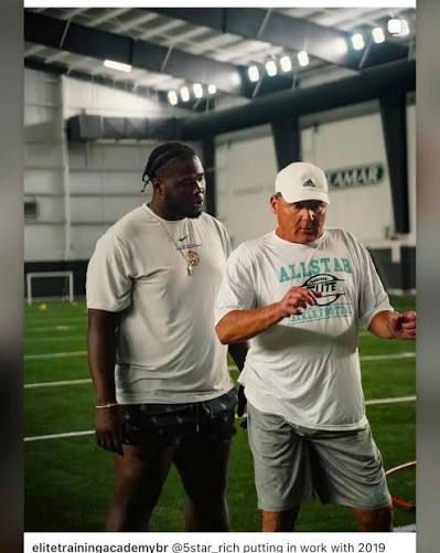 Coach O (right) teaching technique with Rich Anderson (left) ©️ Elite Training Academy