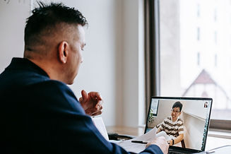 Man on a video call with a partner organization