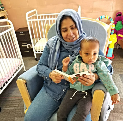 teacher reading to toddler