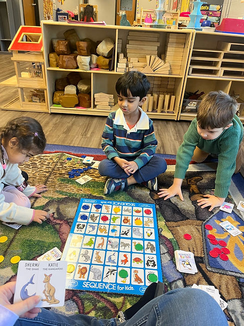 students playing sequence board game