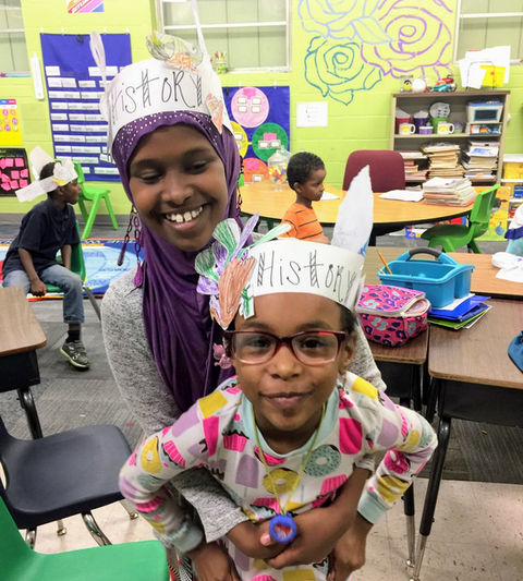 teacher and student smiling