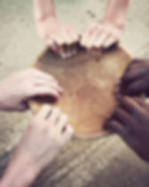 Hands Holding Wooden Plate