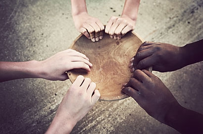 Hands Holding Wooden Plate