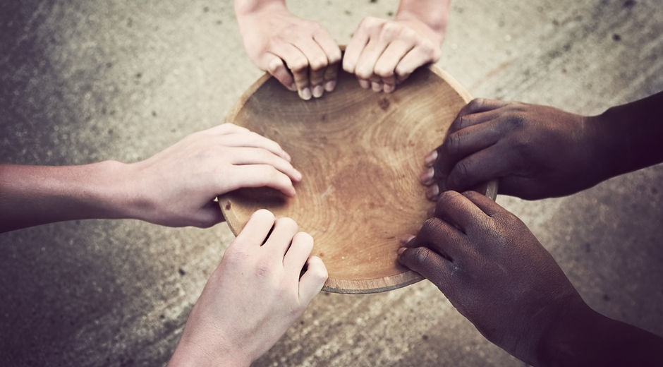 Hands Holding Wooden Plate