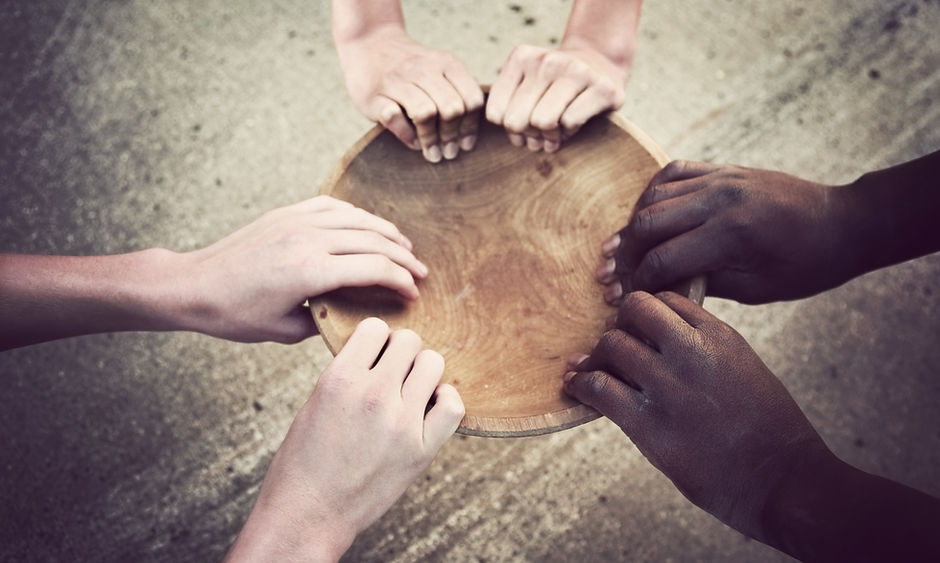 Hands Holding Wooden Plate