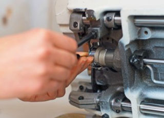 JoDo Sewing Machine Repair Service. Sewing machine under repair.
