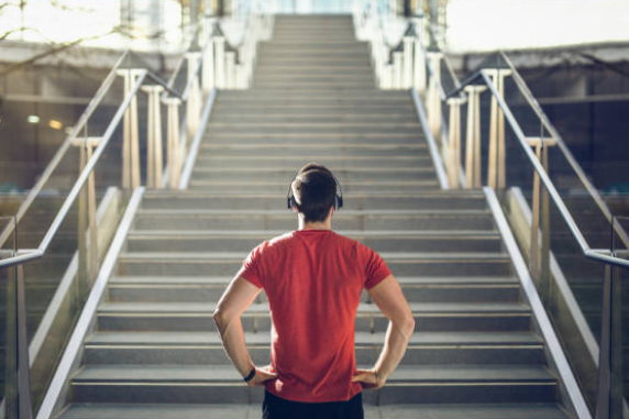 A man standing in front of lots of steps.