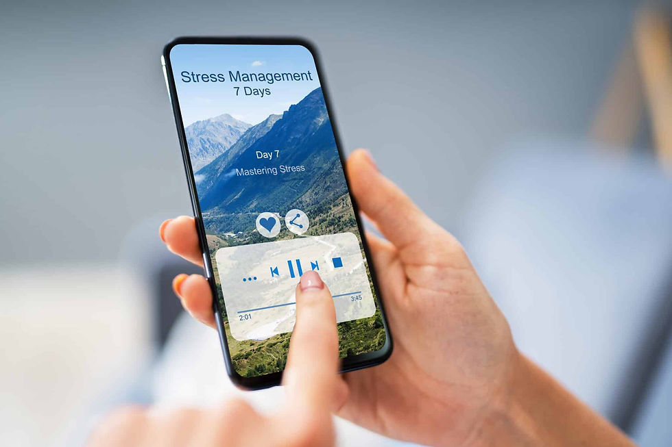 A woman holding her smartphone and playing a stress management recording.