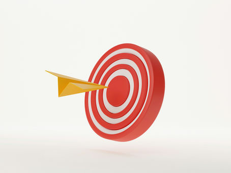 Red and white target with a yellow paper airplane striking the center. Minimalistic design on a white background.