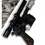 Thumbnail: Angled DL-44 carbine pistol replica showcasing wood-effect grip, silver flash suppressor, and weathered finish against a Star