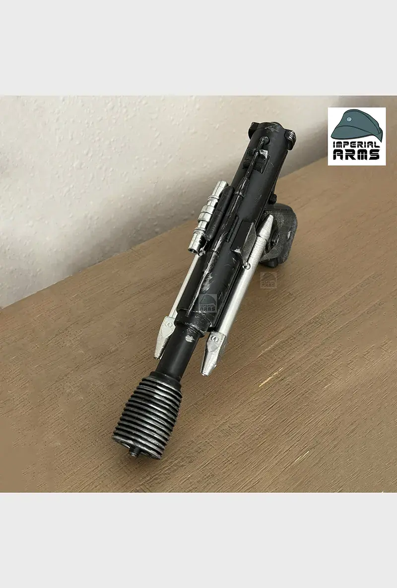 Thumbnail: DT-12 prop pistol replica displayed on tabletop under natural lighting – ready for cosplay or display
