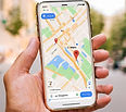 person holding iPhone with google maps open.jpg