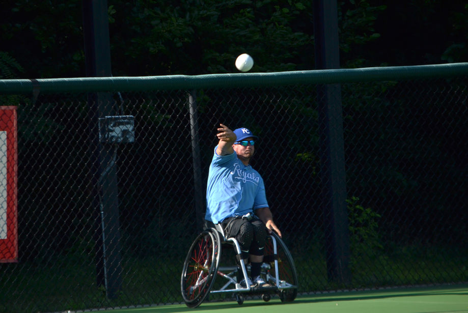 Kansas City Royals player makes throw to first base from outfield.