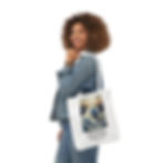 Thumbnail: Smiling woman holds Christian Tote Bag The Great Wave, James 1:6 verse