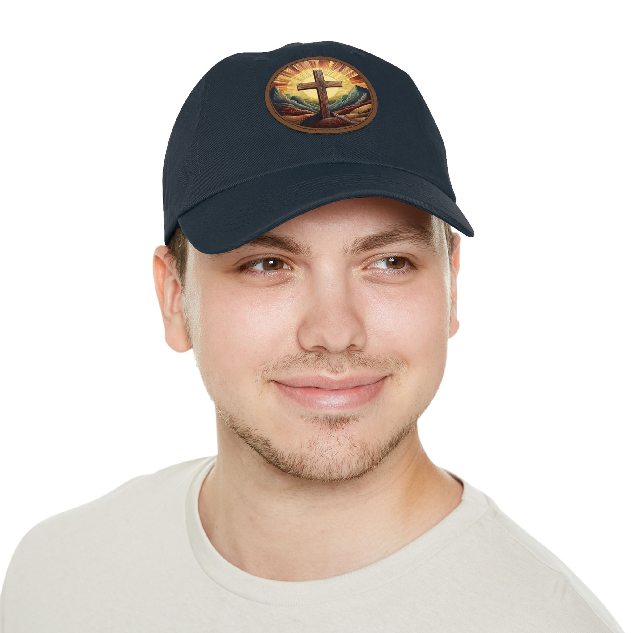 Man wearing dark baseball cap with cross emblem