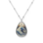 Silver necklace, teardrop pendant: Cross and ocean waves.