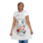 Woman wearing colorful apron that says God Brings Beauty From Ashes