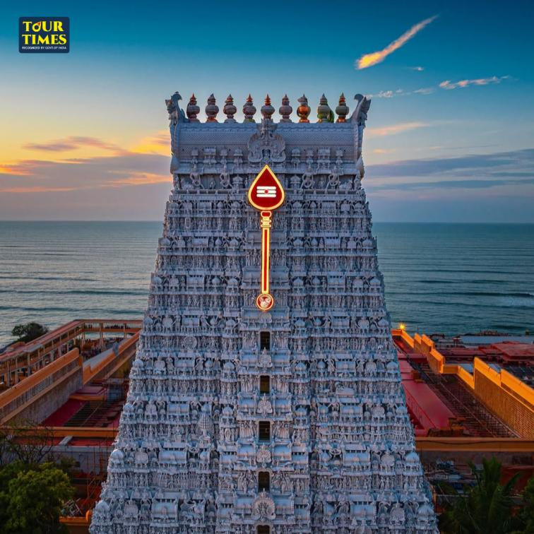 Intricate temple tower with glowing symbol at sunset, overlooking ocean. "TOUR TIMES" text on top left. Serene and majestic scene.Murugan Temples in Tamil Nadu