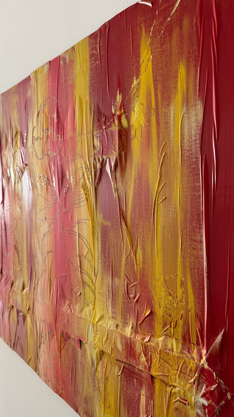 Red, yellow and white acrylic flowers and leaves painting on recycled cardboard box