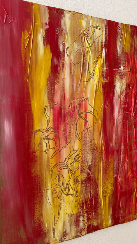 Red, yellow and white acrylic flowers and leaves painting on recycled cardboard box.