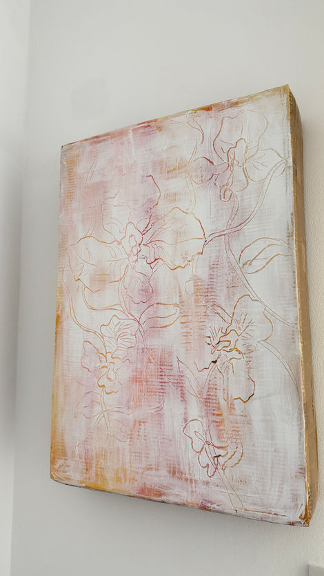 White, red and yellow acrylic flower painting on recycled cardboard box.