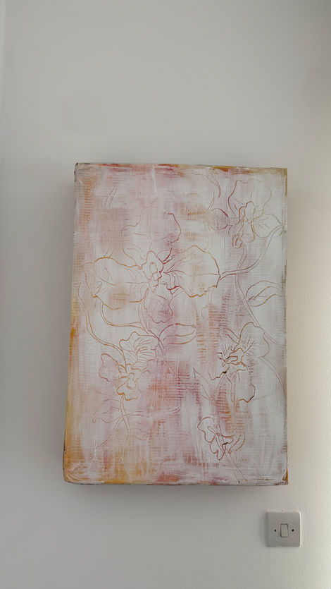 White, red and yellow acrylic flower painting on recycled cardboard box.