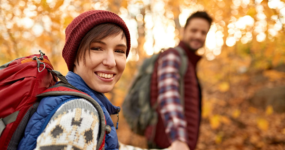 a woman and man hiking with their custom promotional products