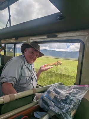 Elderly traveler on private safari jeep in Tanzania