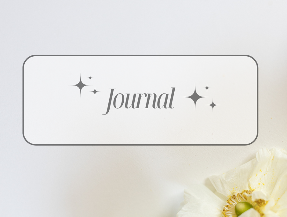 White background with "Journal" text in gray, surrounded by stars. A white flower is at the bottom right, creating a peaceful mood.