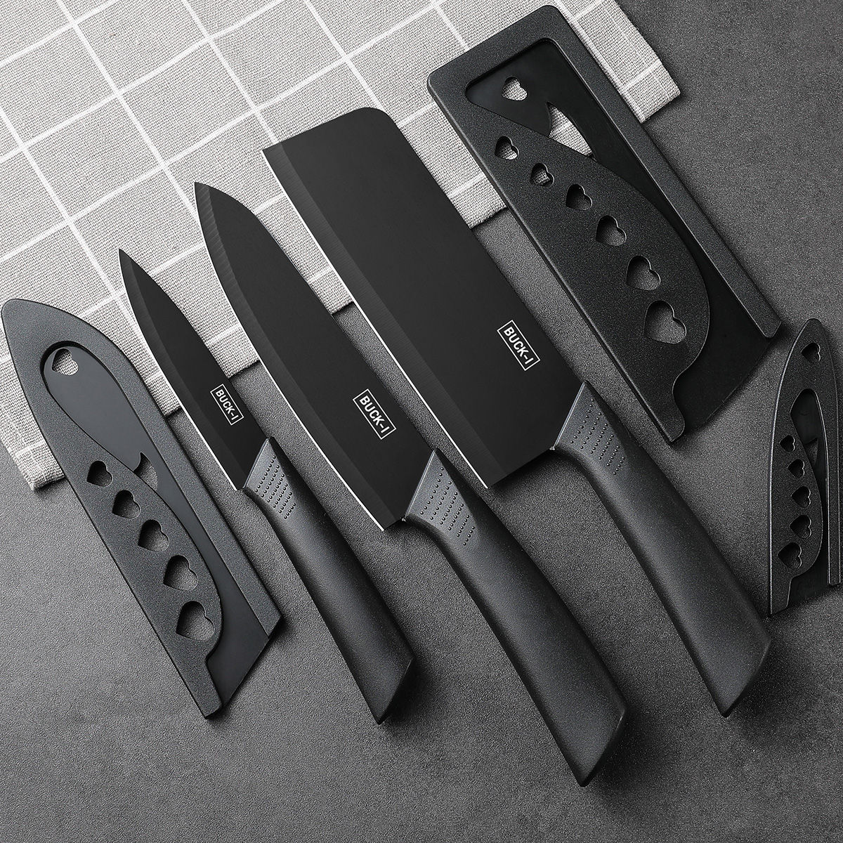 Kitchen knife set, including cleaver, chef's knife, and fruit knife, with knife