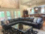 Main House family room couch with doors to screened porch