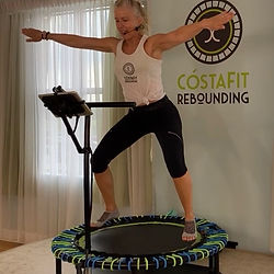 instructor doing jacks on rebounder